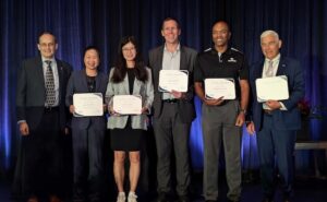 2025 ASEE Fellows posing with certificates