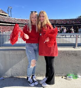 Erika Landree at a football game with a friend