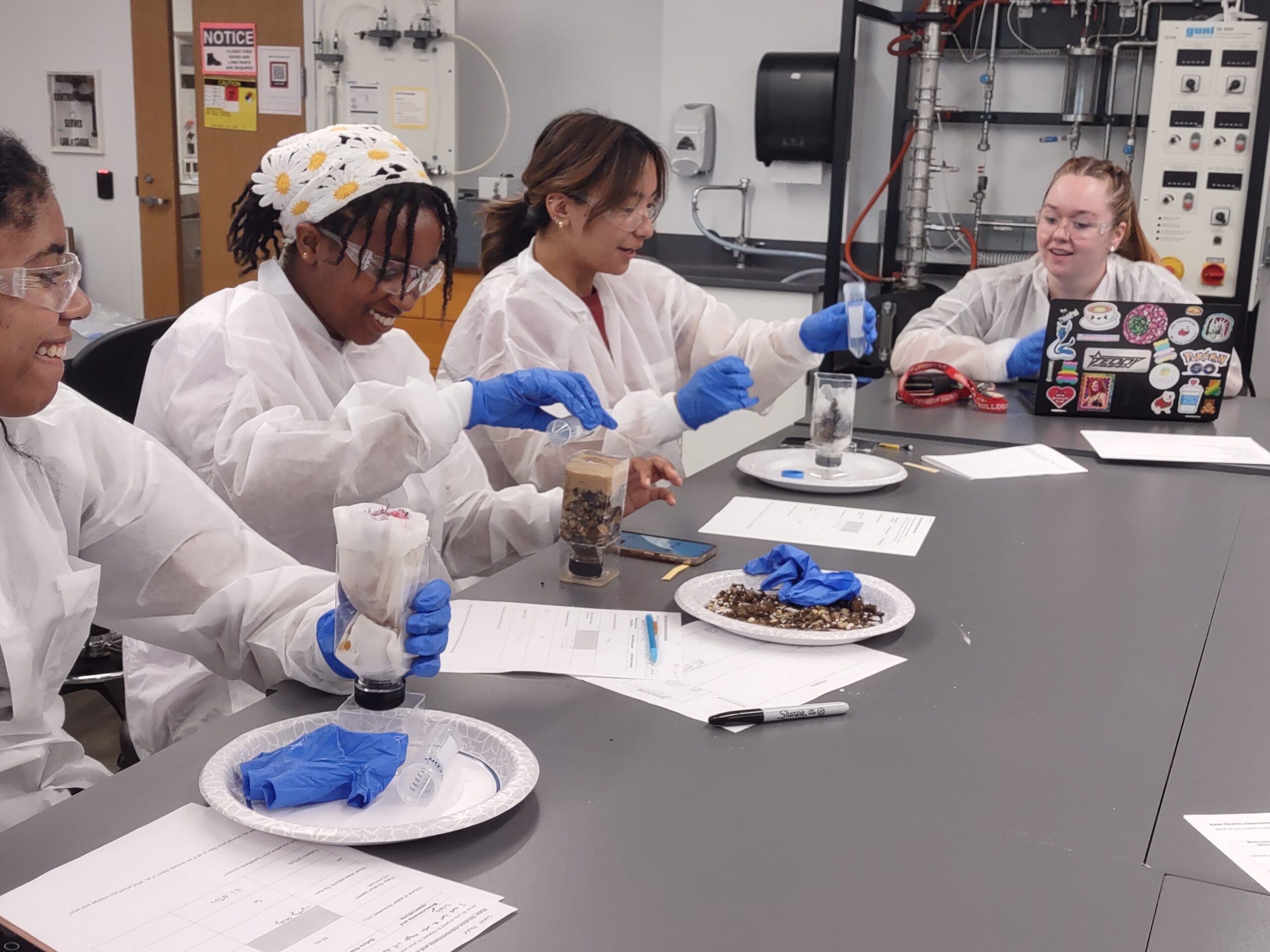 students perform experiments at a table