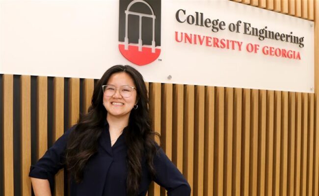 Sofie Mayfield portrait with College of Engineering sign in the background