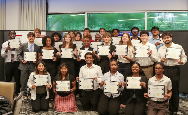 group of students holding certificates
