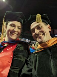 Catherine Ball and Kyle Johnsen pose for a selfie at commencement