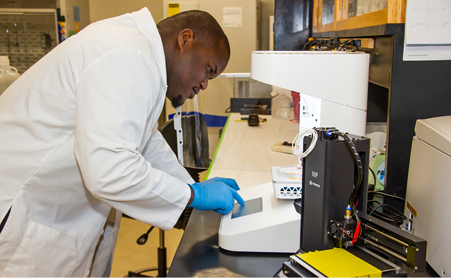 Damion Dixon working in a lab