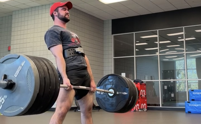 Dominic Mastronardi lifting heavy weights in gym