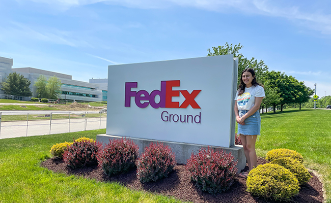 Maria Martin with FedEx sign