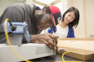 Description: l-r: Aneek James, a junior electrical engineering major from Stone Mountain, and Professor Mable Fok.