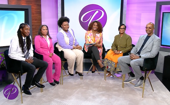 group of individuals posing on Portia TV Show set