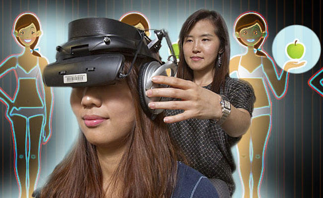 Researcher places VR headset on woman